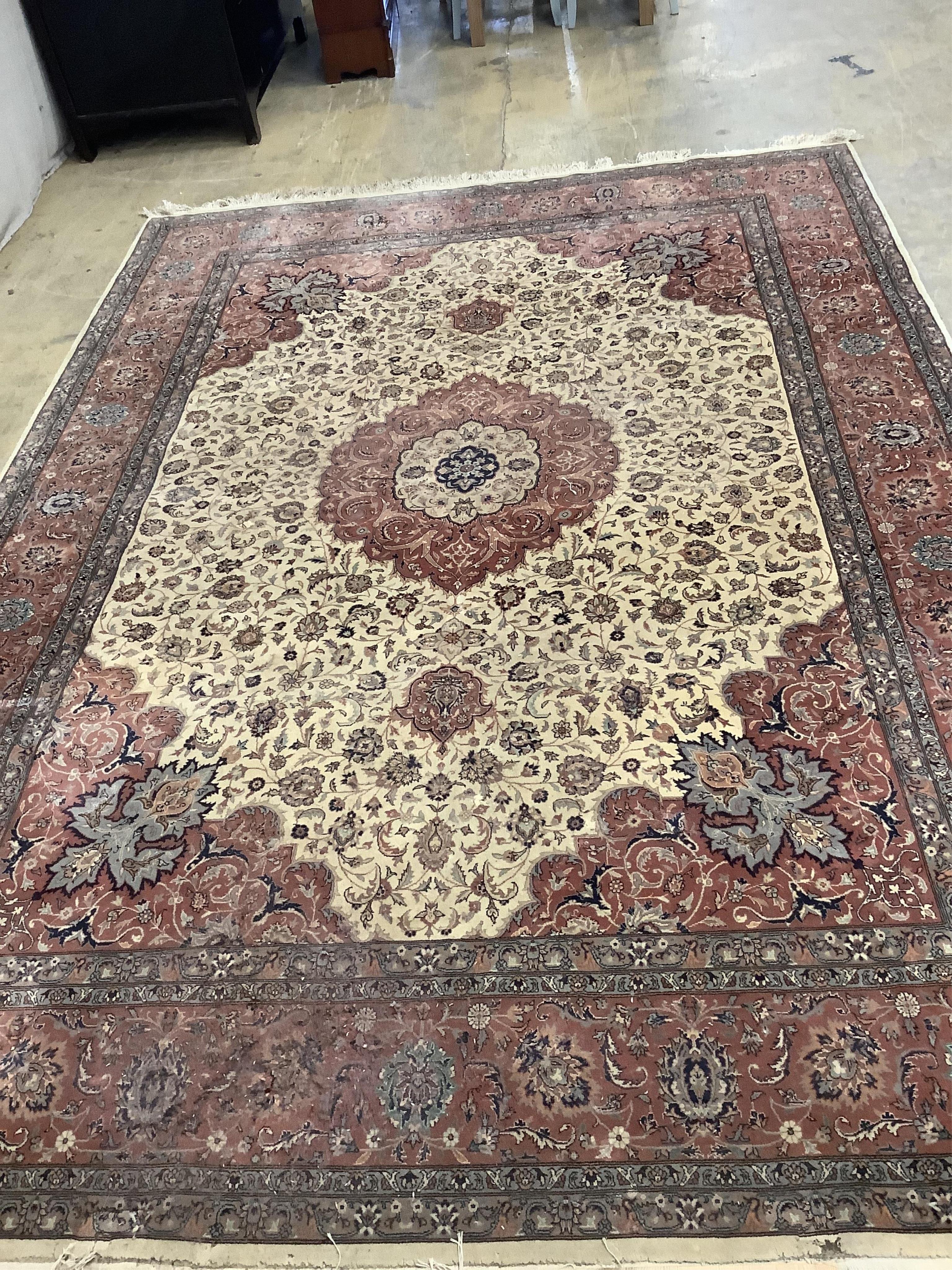 An Isfahan design ivory ground rug, approximately 340 x 246cm. Condition - good